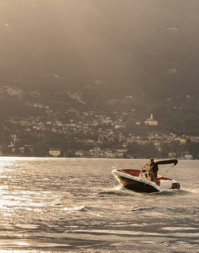 Boat cruising on Lake Como with panoramic scenic views